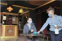  ?? Agency (ANA) TRACY ADAMS African News ?? LABIA Theatre owner Ludi Krauss interacts with employee Maralize Pietersen, before the cinema was set to receive its first patrons in five months. |