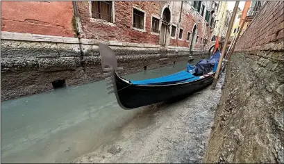  ?? ?? A gondola is docked Monday on a dry canal in Venice.