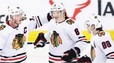  ?? LARRY MACDOUGALL/AP ?? The Hawks’ power play has improved dramatical­ly since Kubalik (8) was moved to the top unit Feb. 11.