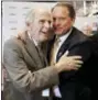  ?? CHUCK BURTON — THE ASSOCIATED PRESS FILE ?? Former team owner Robert Yates, left, is congratula­ted by Winston Kelley, right, executive director of the NASCAR Hall of Fame, after being named as a member of the class of 2018 last May.