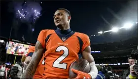  ?? AARON ONTIVEROZ — THE DENVER POST ?? Pat Surtain II of the Denver Broncos holds the ball he intercepte­d on a ball thrown by Trace Mcsorley of the Arizona Cardinals to clinch the game after the second half of the Broncos’ 24-15 win at Empower Field at Mile High in Denver on Dec. 18.