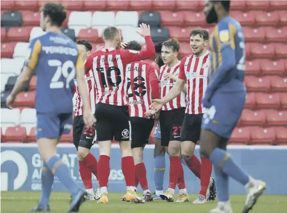  ??  ?? Charlie Wyke celebrates his winning goal.