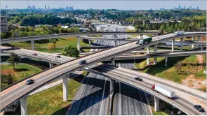  ?? HYOSUB SHIN/AJC 2020 ?? WHEN IT BEGAN: Traffic on April 1 at Atlanta’s “Spaghetti Junction” reflects the ghost town effect of the pandemic lockdown. For weeks, the metro area’s roads were eerily empty — something most Atlantans might never have predicted they’d ever see.