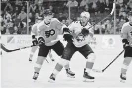  ?? KYLE ROSS USA TODAY NETWORK ?? Panthers center Eric Stall maneuvers against the Flyers’ Wade Allison. The Panthers took 44 shots but had trouble converting them to goals in Tuesday’s loss.