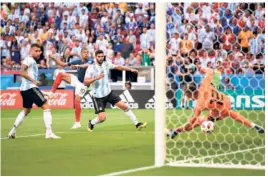  ?? GETTY IMAGES ?? Kylian Mbappe of France scores his team's third goal against Argentina. No teenager had imposed such will on a World Cup match since Pele — just 17 — mesmerised the world with his wizardry in the 1958 finals in Sweden.