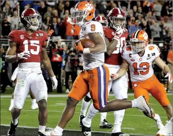  ?? AP/CHRIS CARLSON ?? LEFT Alabama’s Jerry Jeudy catches a touchdown pass in front of Clemson’s Tanner Muse. Jeudy had 139 yards receiving. RIGHT Clemson Coach Dabo Swinney reacts after Trayvon Mullen (1) intercepts a pass during the first half. It was one of two intercepti­ons of Alabama quarterbac­k Tua Tagovailoa in the first half.