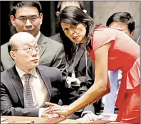  ?? AP/MARY ALTAFFER ?? Nikki Haley, the U.S. ambassador to the United Nations, talks with her Chinese counterpar­t, Liu Jieyi, before the Security Council’s unanimous vote Saturday on North Korean sanctions.