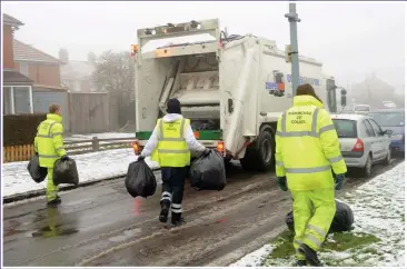  ??  ?? KEEPING BRITAIN MOVING: Refuse staff are among those who have suffered most from Covid