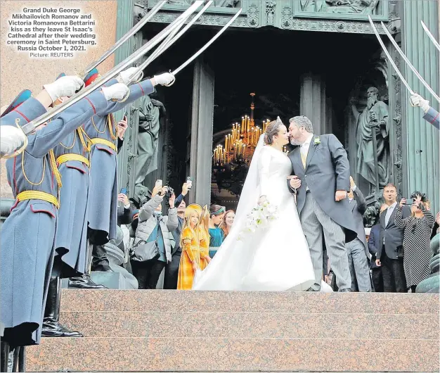  ?? Picture: REUTERS ?? Grand Duke George Mikhailovi­ch Romanov and Victoria Romanovna Bettarini kiss as they leave St Isaac’s Cathedral after their wedding ceremony in Saint Petersburg, Russia October 1, 2021.