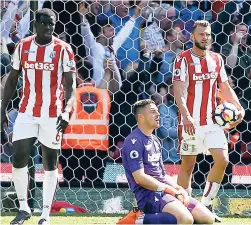  ??  ?? Stoke City goalkeeper Jack Butland (centre) reacts after Crystal Palace’s Patrick van Aanholt scores his side’s second goal of the game, during the English Premier League match between Stoke City and Crystal Palace, at the bet365 Stadium, in Stoke,...