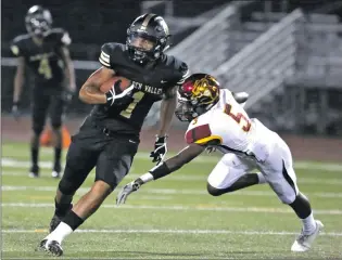  ?? Katharine Lotze/The
Signal (See additional photos on signalscv.com) ?? Golden Valley’s DeGabriel Floyd (1) runs during the first football game of the season against Highland of Palmdale at Canyon High School on Friday.