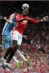  ?? ASSOCIATED PRESS FILE PHOTO ?? Manchester United’s Paul Pogba, right, and Manchester City’s John Stones battle for the ball during their Sept. 10, 2016, Manchester Derby matchup.