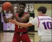  ?? GEORGE POHLY — FOR MEDIANEWS GROUP ?? Donovan Harris of Chippewa Valley sets up a play during a MAC Red game against L’Anse Creuse North on Friday. Harris led the Big Reds with 15 points, but L’Anse Creuse North won the game.