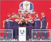  ?? ?? United States celebrate with the Ryder Cup after defeating Europe 19-9 at Whistling Straits, Wisconsin, on Sunday.