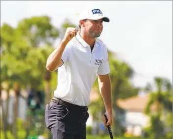  ?? Marta Lavandier Associated Press ?? AUSTIN ECKROAT revels after winning the weather-delayed Cognizant Classic in Palm Beach Gardens, Fla. He shot a four-under-par 67 to finish at 17 under and beat Erik van Rooyen and Min Woo Lee by three strokes.