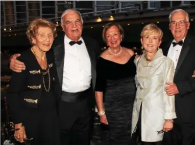  ??  ?? Dan Jannetta of Haverford and John Galloway of Villanova escort Elia Buck, Sally Jannetta and Nancy Galloway, a vice president of the Women’s Board, to the dinner.