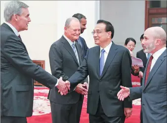  ?? FENG YONGBIN / CHINA DAILY ?? Premier Li Keqiang, flanked at right by US-China Business Council Chairman Evan Greenberg, meets with council representa­tives at the Great Hall of the People in Beijing on Thursday.