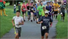  ??  ?? People run from the start line of a 5K trail run held at Riverfront Park in Pottstown. The course was along the Schuylkill River Trail.