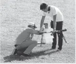  ?? MEL EVANS/ASSOCIATED PRESS PHOTOS ?? Workers load a package of simulated blood and other medical samples to be carried in a drone during a simulation in Lower Township, N.J.