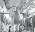  ??  ?? Shatner trades his communicat­or for a mike as he shows off his karaoke skills on a bus trip in Japan.