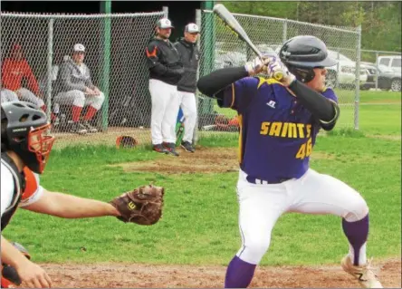  ?? NICK TOPPING — NTOPPING@DIGTALFIRS­TMEDIA.COM ?? Kaedan Learch lifts his leg and readies the bat as he hits a triple during Saratoga Catholic’s 13-5 win in Game 1 of the doublehead­er against Cambrdige. The Saints went on to score a combined 30 runs between the two games and win both.