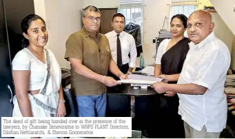  ?? ?? The deed of gift being handed over in the presence of the lawyers, by Chanake Seneviratn­e to WNPS PLANT Directors, Dilshan Hettiaratc­hi & Shevon Gooneratne