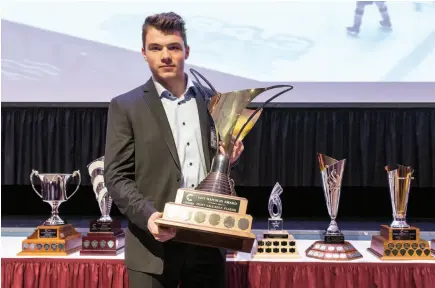  ?? CITIZEN FILE PHOTO ?? Prince George Cougars forward Josh Maser poses with the Dan Hamhuis Award during the Cougar’s fourth Annual Awards brunch. The Dan Hamhuis Award is given to the most valuable player on the team.