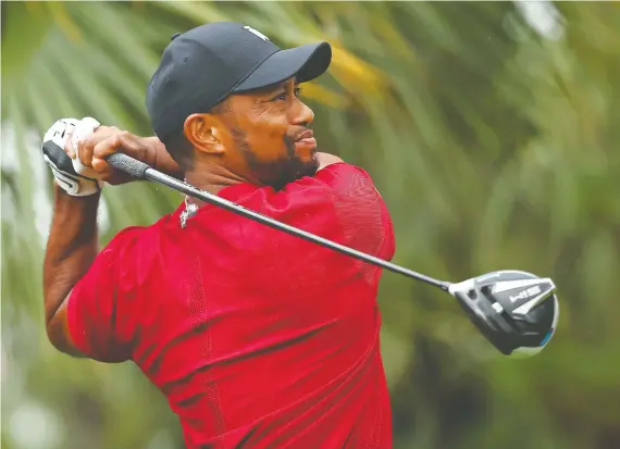  ?? MIKE EHRMANN/GETTY IMAGES/FILES ?? After four knee surgeries and four operations on his back, Tiger Woods has plenty of experience coming back to the Pro Tour after a prolonged layoff.