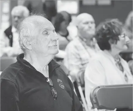  ?? NICK BRANCACCIO ?? Stephen Poisson and other residents of The Shoreview at Riverside listen to Dr. Christophe­r Blue speak on medical pot on Tuesday.