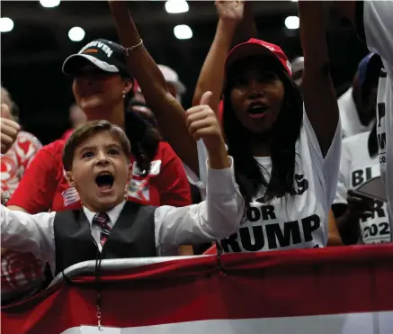  ??  ?? Fanbase: Members of the crowd at the Trump rally in Florida on Wednesday