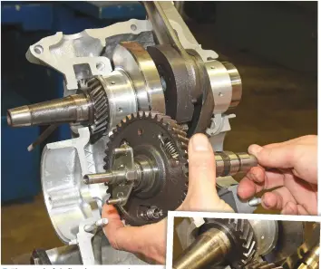  ??  ?? 3
The camshaft is fitted next, ensuring that the two lines on the side of its drive gear teeth line up with a single line on the crankshaft’s drive gear, as shown here (inset). Add more engine oil for lubricatio­n.