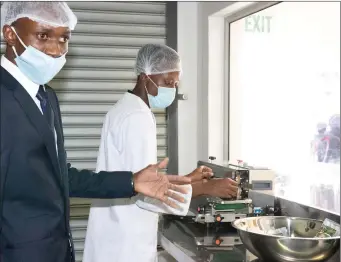  ??  ?? Valde Leonard demonstrat­es how VNA Foods packages Omboga powdered spinach soup. VNA won the 2018 Developmen­t Bank of Namibia (DBN) Innovation Award, and it was supported by the Bank in developing its recipe and process.