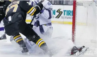  ?? Elise Amendola/The Associated Press ?? Steven Stamkos, below, broke his tibia and is scheduled to have surgery after banging his leg into the goalpost defending against the Boston Bruins’ Dougie Hamilton on Monday.