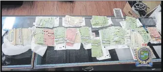  ?? NIAGARA REGIONAL POLICE ?? As much as $40,000 in cash was seized from a Niagara Falls pawn shop on May 22.