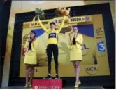  ?? AP PHOTO/CHRISTOPHE ENA ?? Britain’s Geraint Thomas celebrates his overall leader’s yellow jersey after winning the first stage of the Tour de France cycling race, an individual time trial over 14 kilometers (8,7 miles), with start and Finish Saturday in Duesseldor­f, Germany.