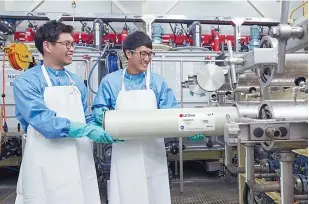  ?? Courtesy of LG Chem ?? LG Chem employees test a reverse osmosis filter at the company’s plant in Cheongju, North Chungcheon­g Province.