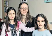  ??  ?? Support: Breast cancer victim Lindsey Roe with daughters Emily, six, and Claire, nine