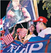  ??  ?? Trump supporters cheering outside Miami’s Versailles Cuban restaurant