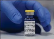  ?? ALASTAIR GRANT — THE ASSOCIATED PRESS ?? A vial of the Phase 3 Novavax coronaviru­s vaccine.