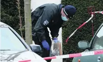  ?? Sascha Steinbach / EPA ?? A German police officer outside Borussia Dortmund’s team hotel after their bus was hit by three explosions.