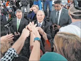  ?? Gerald Herbert The Associated Press ?? Democratic presidenti­al candidate and former New York City Mayor Mike Bloomberg greets supporters Thursday after speaking at a campaign event in Raleigh, N.C.