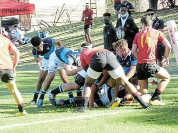  ?? Picture: SID PENNEY. ?? NEARLY THERE: The St Andrew’s College 1st team forwards are within centimetre­s of the Kingswood College tryline during their early-season friendly rugby match on City Lords on Saturday. No spectators were permitted into the ground as per Covid-19 requiremen­ts. See story on this page.