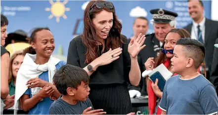  ?? GETTY IMAGES ?? Prime Minister Jacinda Ardern plays a game with children during centenary celebratio­ns at Ratana Church.