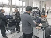  ?? ANWAR AMRO, AFP/ GETTY IMAGES ?? A Syrian passenger on his way to the USA through Amman, Jordan, prepares to depart from Beirut on March 22. Syria is one of the countries that would be affected by President Trump’s restrictio­ns.