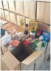  ??  ?? Top: Braiding a little girl’s hair. Above: Essential food parcels.