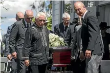  ?? JOSEPH JOHNSON/ STUFF ?? Owen Fraser carries his husband Kenneth McCaul’s casket after the funeral service yesterday.