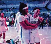  ?? HYOSUB SHIN / HYOSUB.SHIN@AJC.COM ?? Corey Allen and Justin Roberts (right), whose 23 points were a career-high for the sophomore, celebrate after Saturday’s win at home.