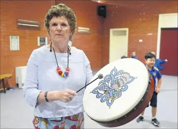  ?? Pictures: Rodney Braithwait­e ?? Sharing a gift: National Music Teachers Mentor Program mentor Gabrielle Ryan takes music into the Shepparton primary school.