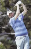  ?? AP PHOTO ?? ON TARGET: Marc Leishman hits an approach shot during the first round of the BMW Championsh­ip yesterday.