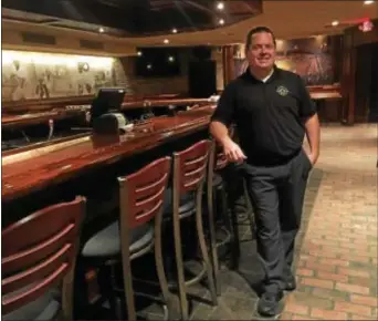  ?? PEG DEGRASSA — DIGITAL FIRST MEDIA ?? Barnaby’s General Manager/Executive Chef Daniel Hurst stands next to the downstairs original bar which was saved in the fire on May 7 that destroyed the outside deck of the restaurant and caused serious damage to the building itself. Barnaby’s of...